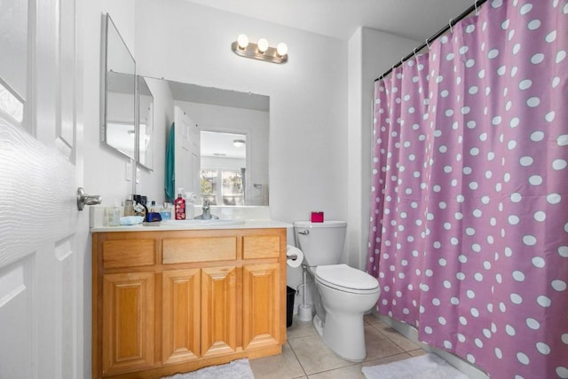 bathroom featuring tile patterned flooring, vanity, toilet, and a shower with shower curtain