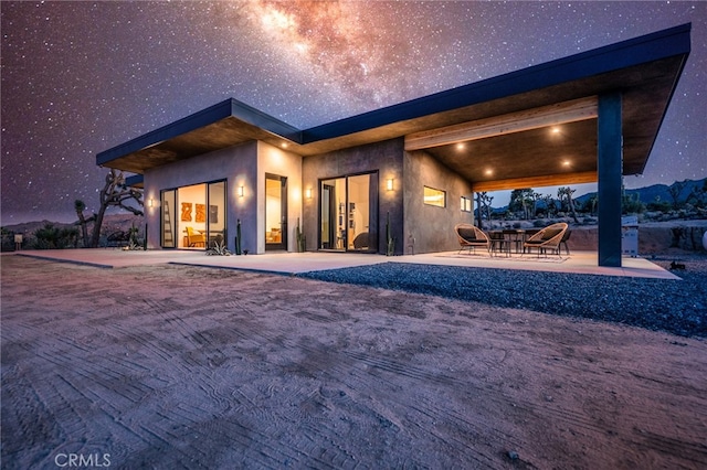 back of house featuring a patio