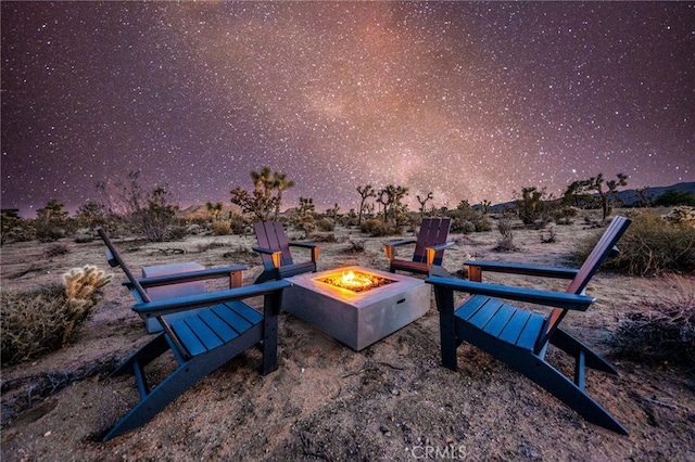 view of home's community featuring a fire pit