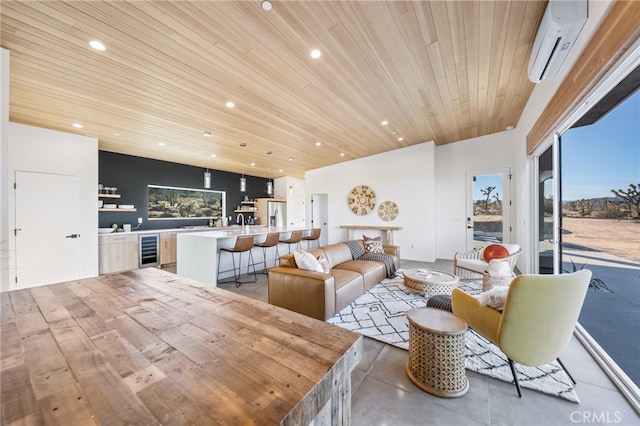 living room featuring wine cooler, an AC wall unit, and wood ceiling