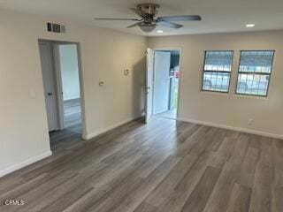 unfurnished room featuring dark hardwood / wood-style flooring and ceiling fan