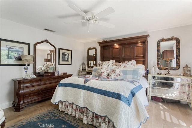 bedroom with hardwood / wood-style flooring and ceiling fan