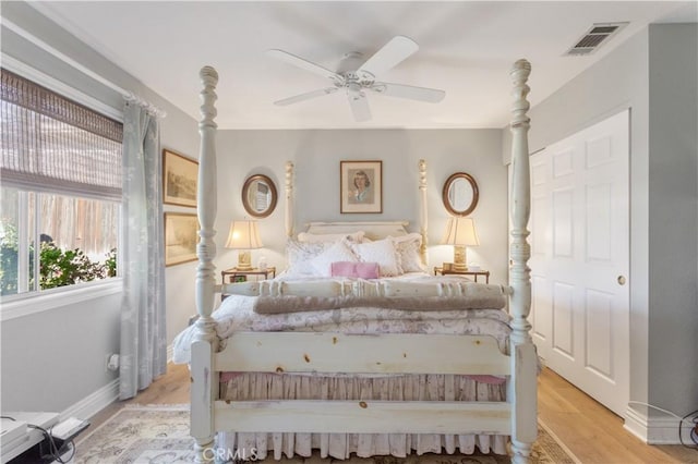 bedroom featuring light hardwood / wood-style floors and ceiling fan