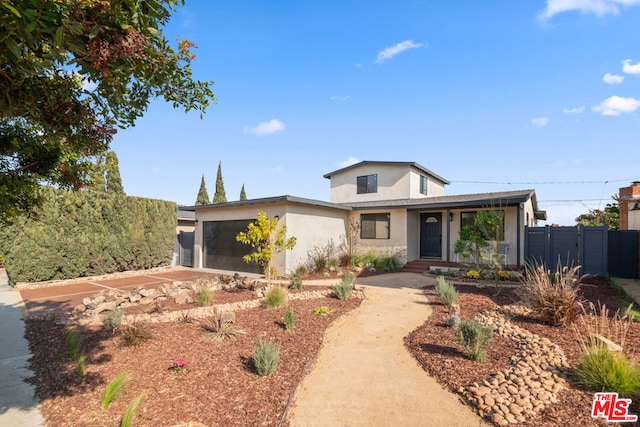 view of front of property featuring a garage