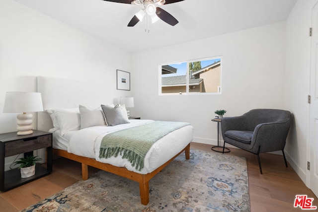 bedroom featuring ceiling fan and light hardwood / wood-style flooring