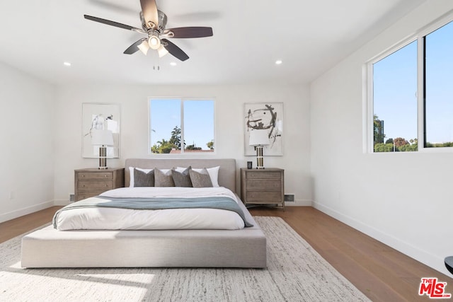 bedroom featuring ceiling fan and hardwood / wood-style flooring