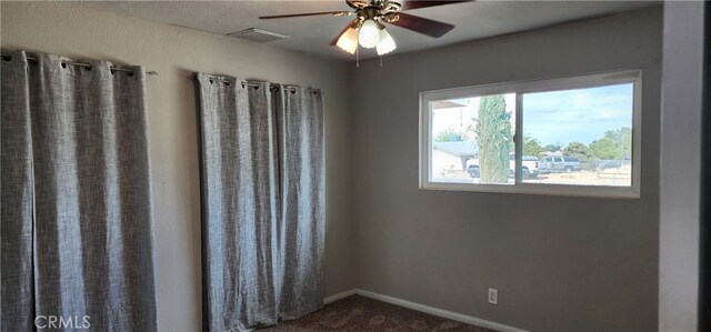 unfurnished room with ceiling fan