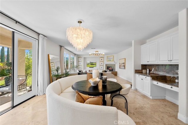 dining room featuring plenty of natural light and a chandelier