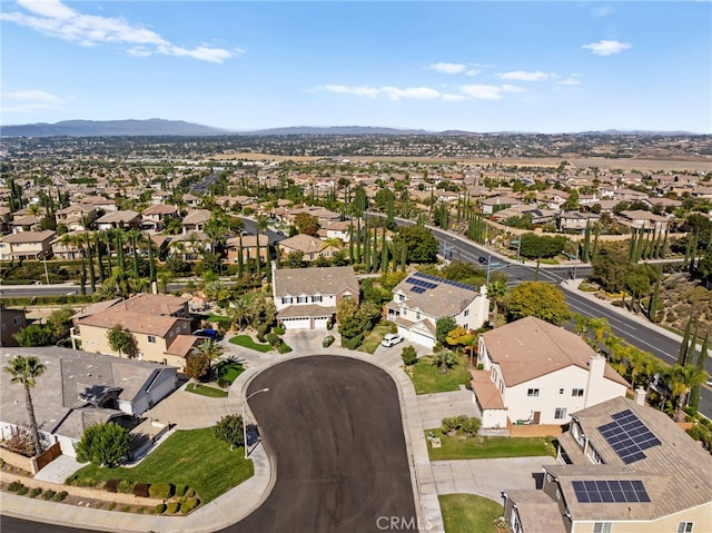 birds eye view of property with a mountain view