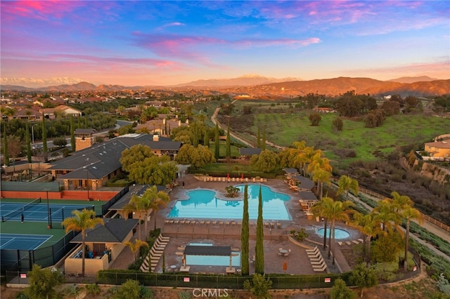 aerial view at dusk with a mountain view