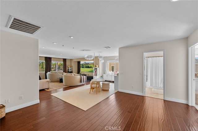 unfurnished living room featuring hardwood / wood-style flooring