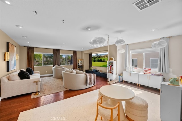 living room with dark hardwood / wood-style flooring