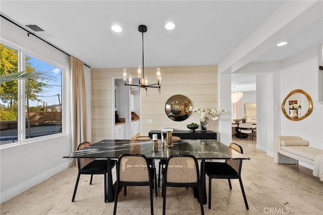 dining room with a notable chandelier