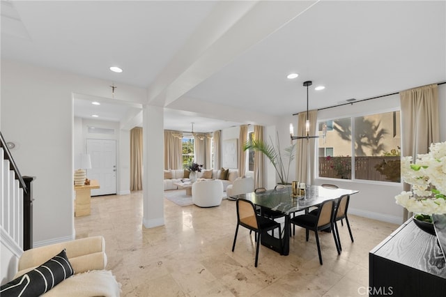 dining area featuring a notable chandelier