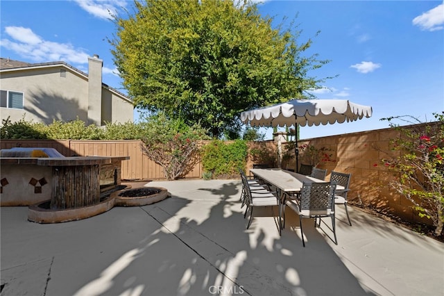 view of patio with an outdoor bar