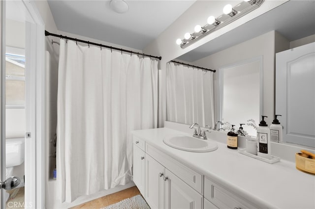 bathroom featuring tile patterned flooring and vanity