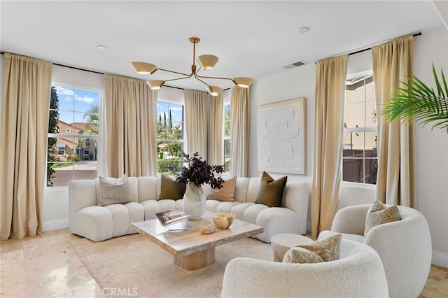 living room featuring a notable chandelier