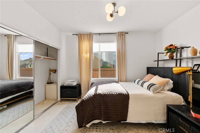 carpeted bedroom with multiple windows and a notable chandelier