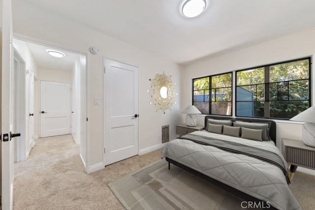 bedroom with light carpet