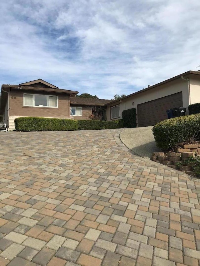 single story home with a garage