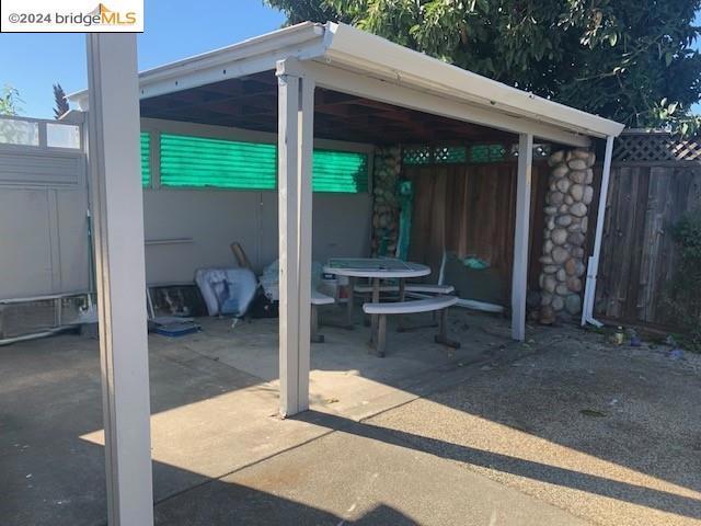 view of patio / terrace with a carport