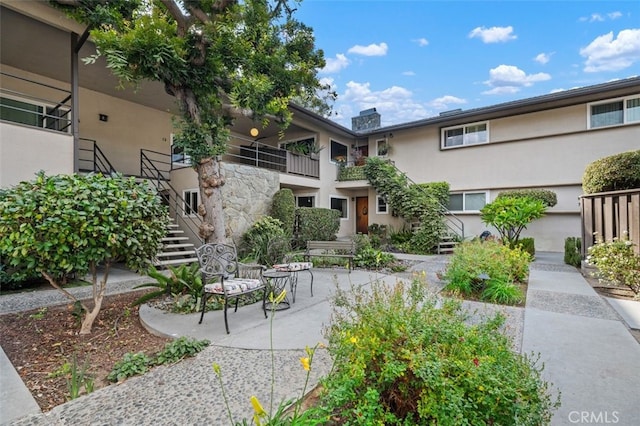 view of home's community with a patio