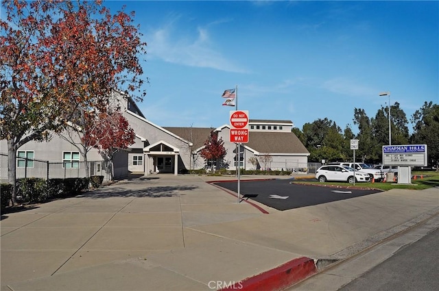 view of street with curbs, traffic signs, and sidewalks