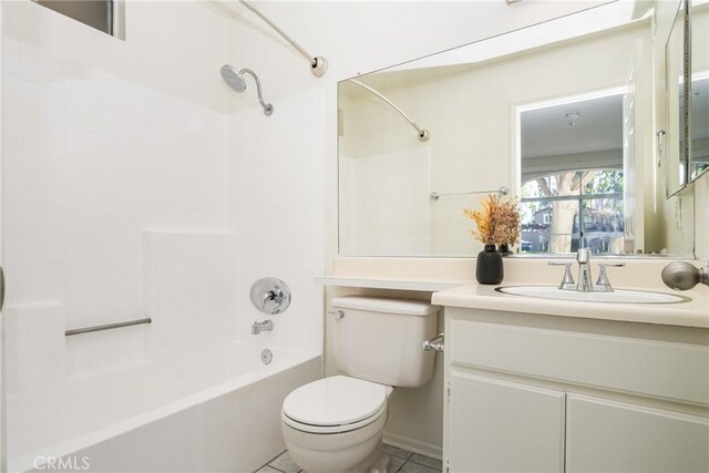 full bathroom featuring tile patterned floors, vanity,  shower combination, and toilet