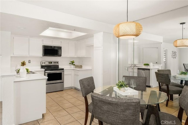 kitchen featuring white cabinets, stainless steel appliances, light countertops, pendant lighting, and light tile patterned flooring