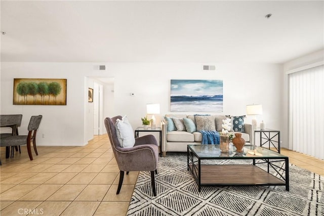 living room with light tile patterned floors and visible vents