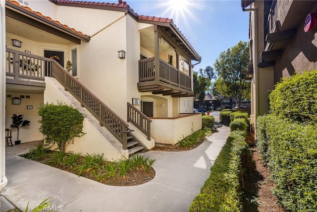 view of home's exterior with a balcony