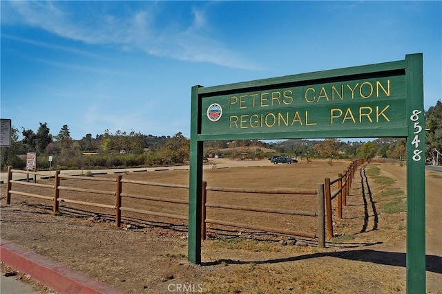 view of home's community with fence