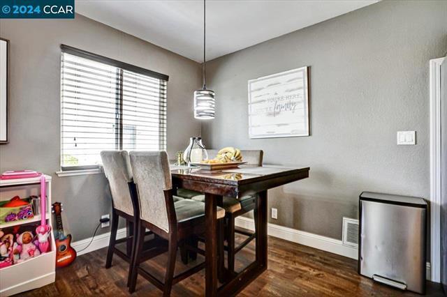 dining room with dark hardwood / wood-style floors