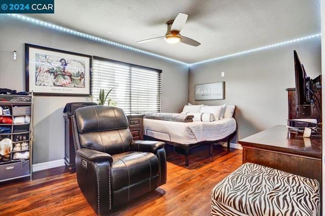 bedroom with ceiling fan and hardwood / wood-style floors