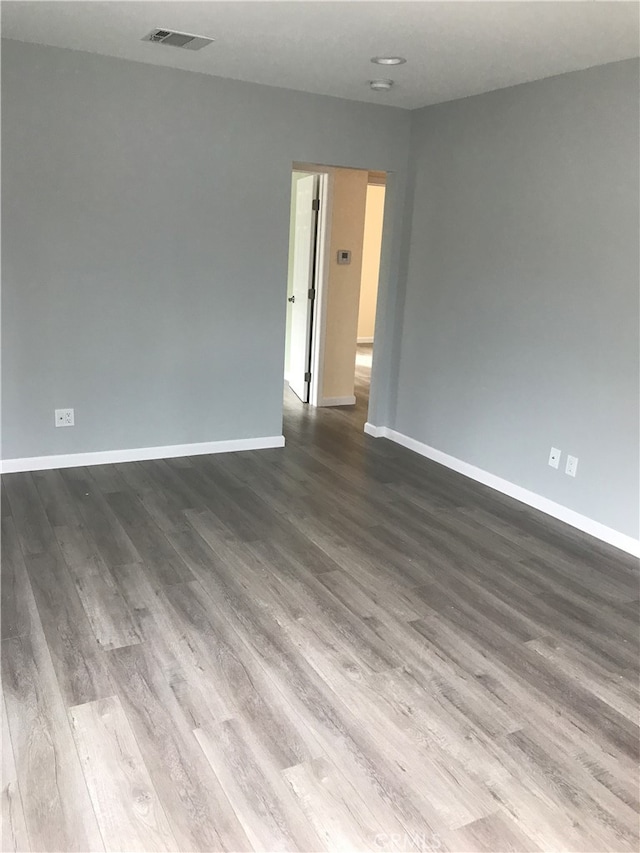 unfurnished room featuring wood-type flooring