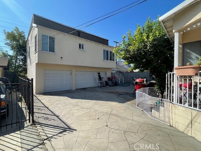 view of side of property featuring a garage