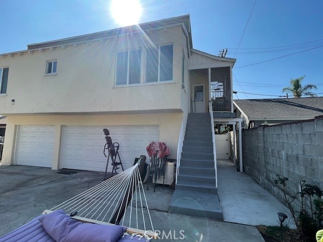 back of property with a garage