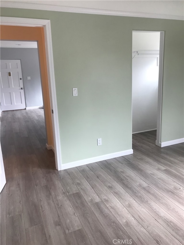 spare room with hardwood / wood-style flooring