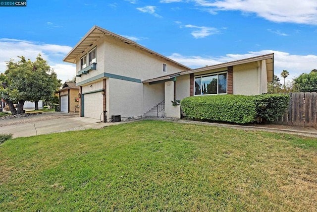 view of front of house featuring a front yard and a garage