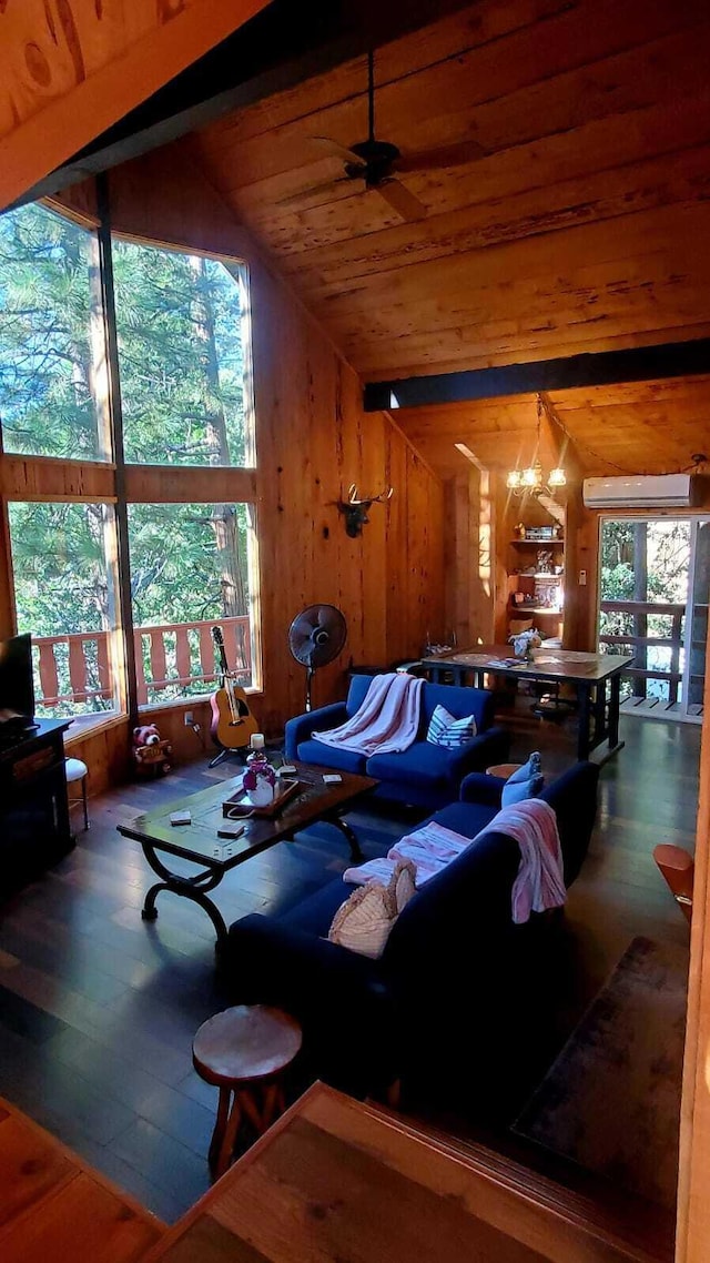 living room featuring ceiling fan with notable chandelier, vaulted ceiling, hardwood / wood-style flooring, wood ceiling, and a wall unit AC