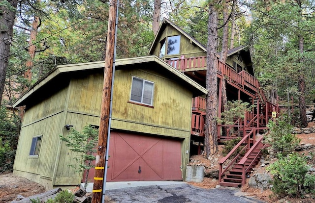 view of side of home featuring a garage