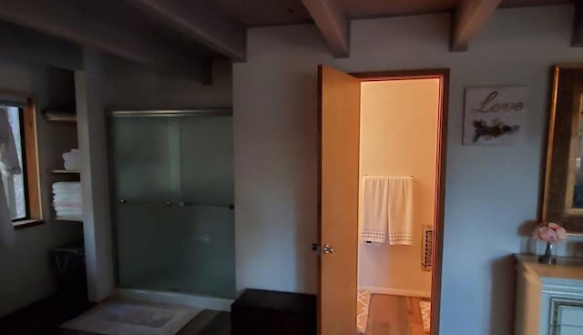 bathroom with beam ceiling