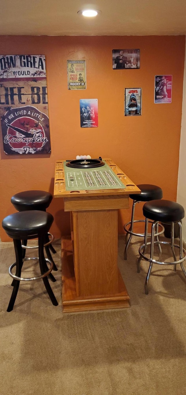 bar featuring tile countertops and carpet flooring