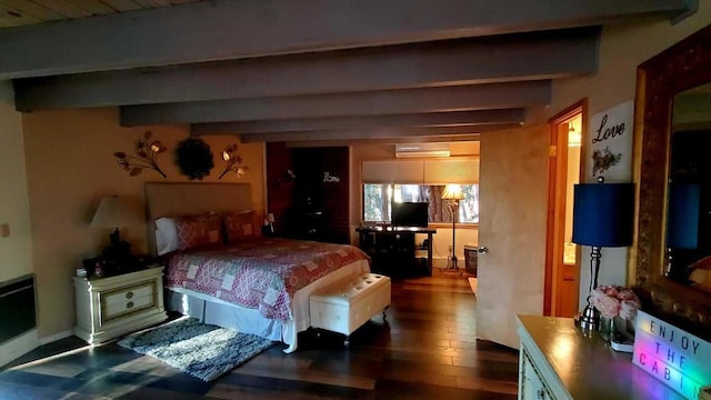 bedroom featuring dark hardwood / wood-style floors, a wall mounted AC, and beamed ceiling