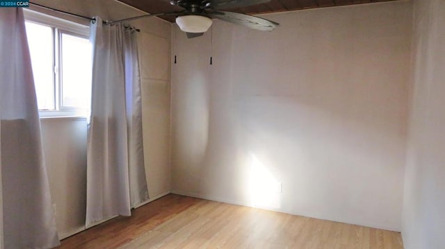 spare room featuring ceiling fan and light hardwood / wood-style floors