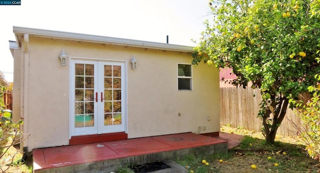 rear view of property featuring french doors