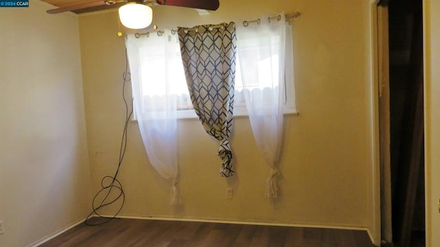 unfurnished room featuring dark hardwood / wood-style flooring