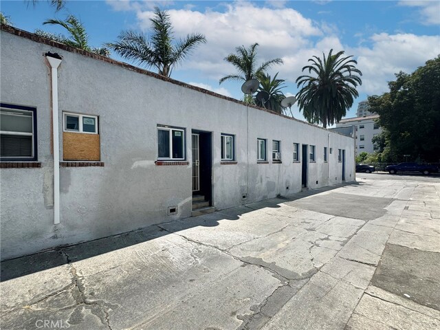 view of side of property with a patio