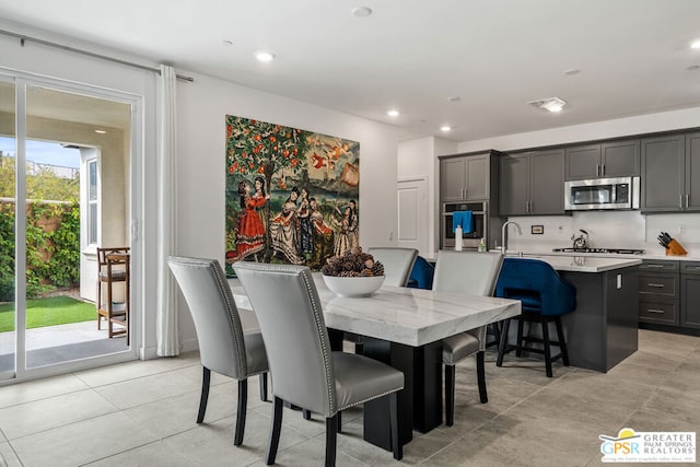 dining space with light tile patterned floors