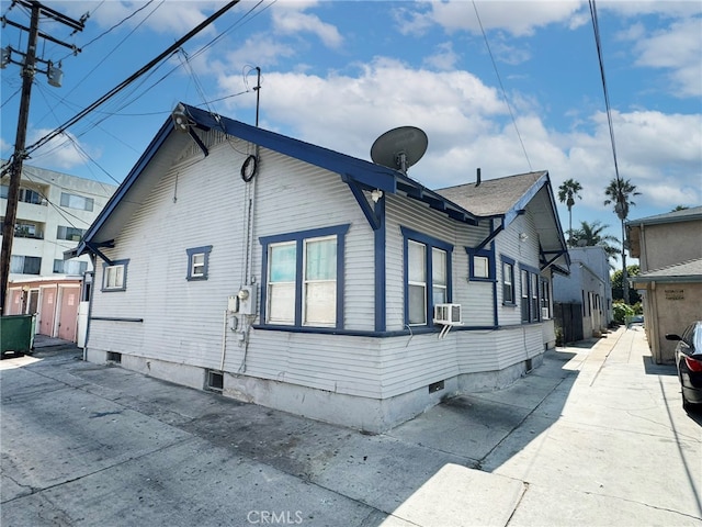 view of home's exterior featuring cooling unit